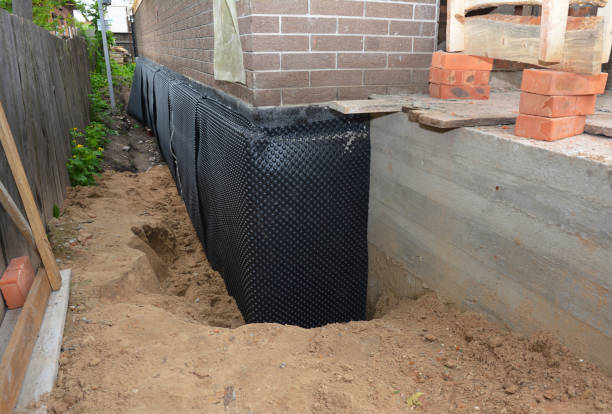 Happy homeowners after waterproofing job in Gallion
